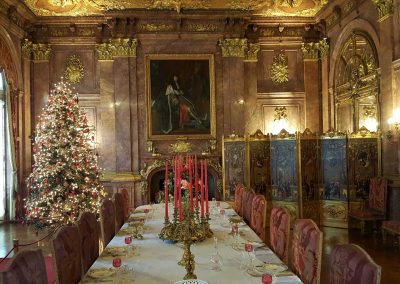 Christmas tree in the dining room at Marble House - a destination included in the Christmas at the Mansions Tour.