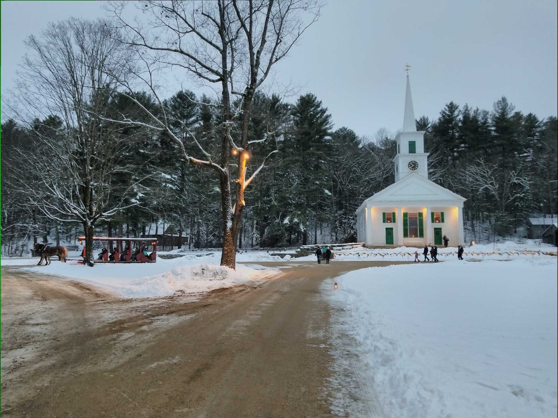 "View of the Center Meetinghouse in Old Sturbridge Village during winter."