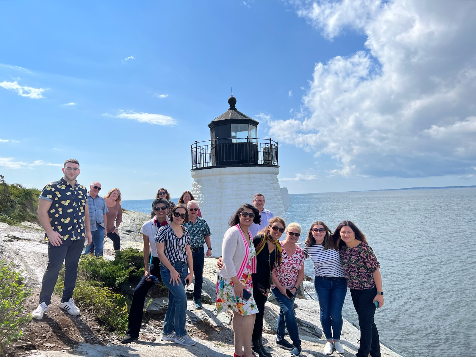 Group picture of tourists at the Castle Hill Lighthouse - a destination included in the Newport: Spectacular City by the Sea.