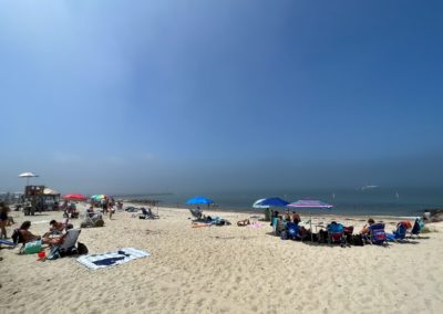 White sand and beach goers at the Chappaquiddick Beach - a destination included in the A Day on Martha's Vineyard Tour.