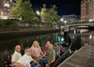 Group of Tourists on a Gondola ride in the evening by the Providence River.
