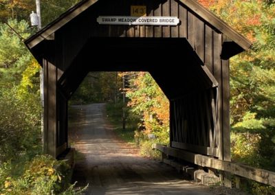 View of the Swamp Meadow Covered Bridge, Foster, RI - a destination included in the Autumn in New England Tour