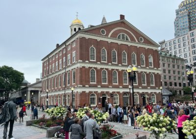 View of the Faneuil Hall Marketplace bustling with people - included in the Best of Boston Tour.