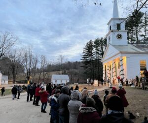 The Center Meetinghouse at Old Sturbridge Village, MA Group of tourists in winter clothes gathering outside the The Center Meetinghouse at Old Sturbridge Village, Sturbridge, MA.