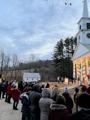The Center Meetinghouse at Old Sturbridge Village, MA Group of tourists in winter clothes gathering outside the The Center Meetinghouse at Old Sturbridge Village, Sturbridge, MA.