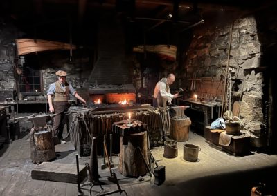 Two Blacksmiths at work at Old Sturbridge Village, Sturbridge, Massachusetts.