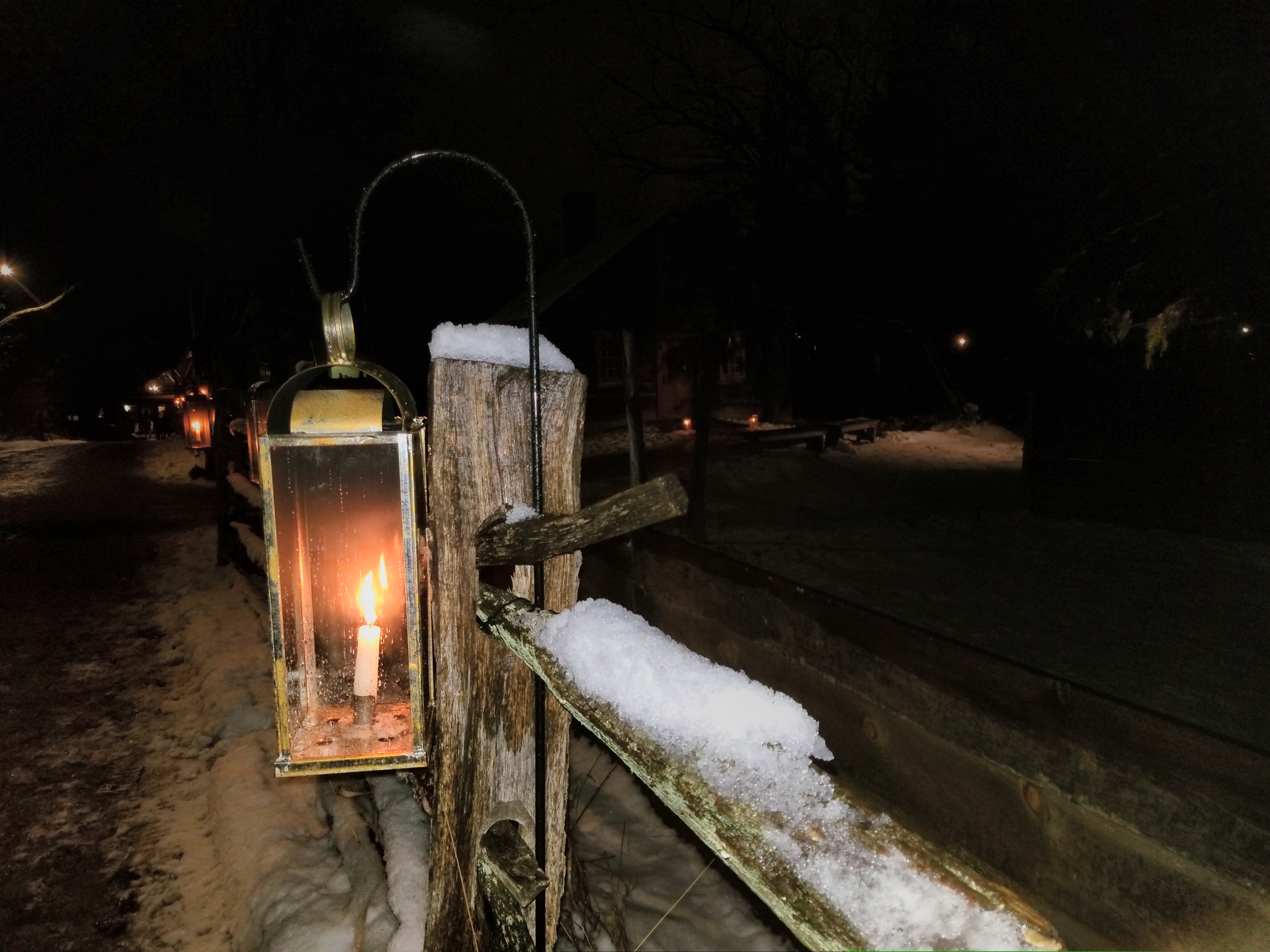 View of old fashioned candle on the street - included in the Christmas by Candlelight at Old Sturbridge Village Tour.