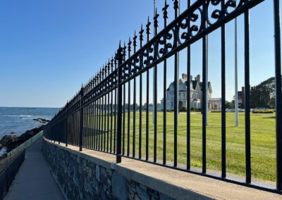 View of the Gilded Age Mansion behind the ornamental fence.