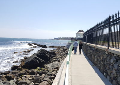 Beach side view of the Newport Cliff Walk - an experience included in the Cliff Walk Tour.