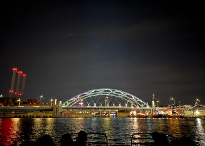 View of the Interstate 195 Bridge at Night by the Providence River - an experience included in the Dinner and a Cruise Tour.