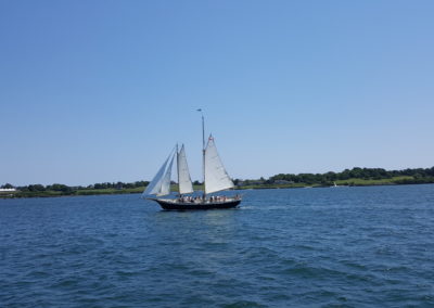Aquidneck sailing the Newport Bay - an experience included in the Newport Sail & Lunch at Sweet Berry Farm Tour.