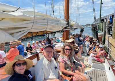 Group of tourists sailing to to Mancini Center- an experience included in Newport Sail and Lunch at Boat House Tour.