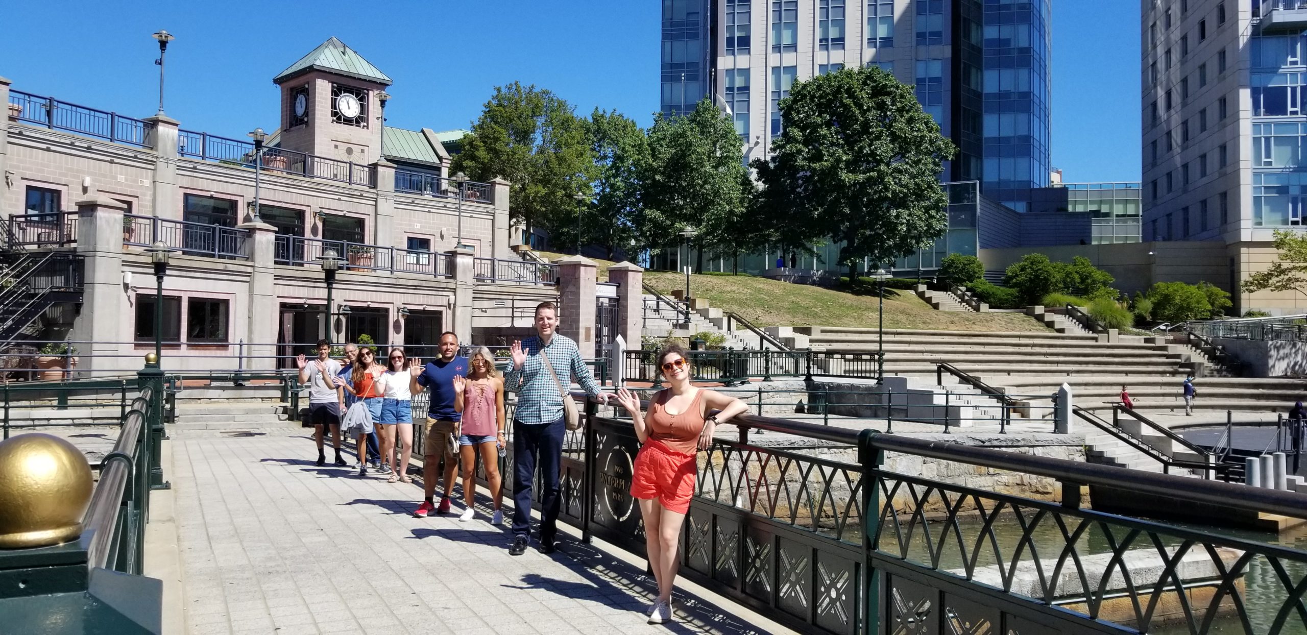 Group picture of tourists at the Providence Pedestrian Bridge - an experience included in the Providence Walking Tour.