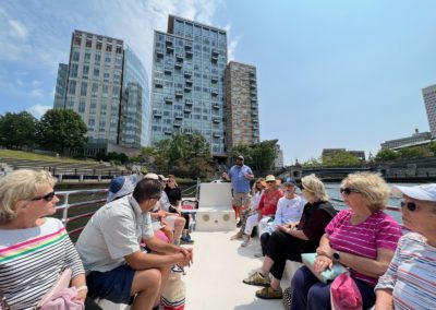 Group of tourists on a cruise sailing by the Providence River - included in the Providence by Road and by River Tour.