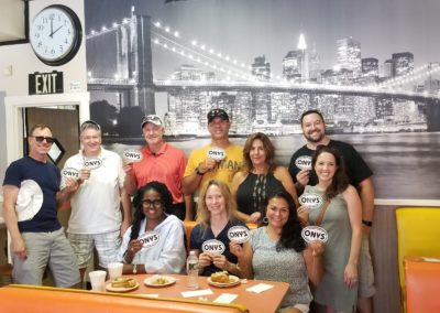 Group of tourists inside the Olneyville New York System Restaurant - a destination included in the Taste of Rhode Island Tour