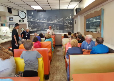 Group of tourist sitting inside the Olneyville New York System Restaurant in Providence, RI.
