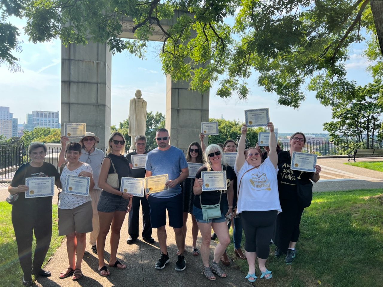Group picture of tourists with their certificates of tour completion at the Roger Williams Park, Providence, RI.