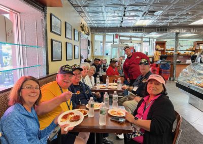 Group of tourist enjoying their italian food - an activity included in the The Italian Experience Tour.