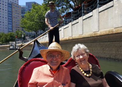 Elderly couple on a Gondola Date - an experience included in the The Italian Experience Tour.