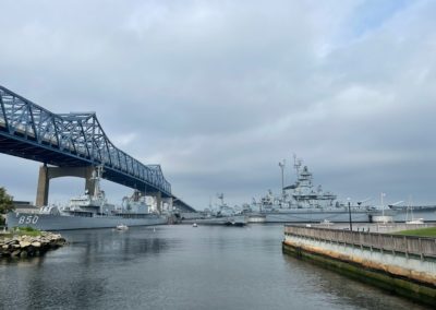 View of the USS Massachusetts beside The Braga Bridge - an experience included in the A Military Experience Tour.