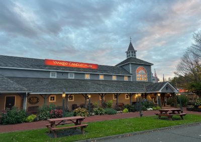 Façade of the Yankee Candle Village Center - a destination included in the Beauty of the Berkshires Tour.