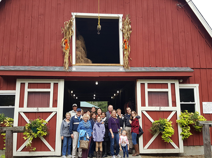 Group photo at a classic fall red barn in New England.